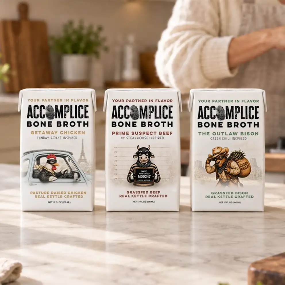 all three accomplice bone broth packaging boxes on marble kitchen counter
