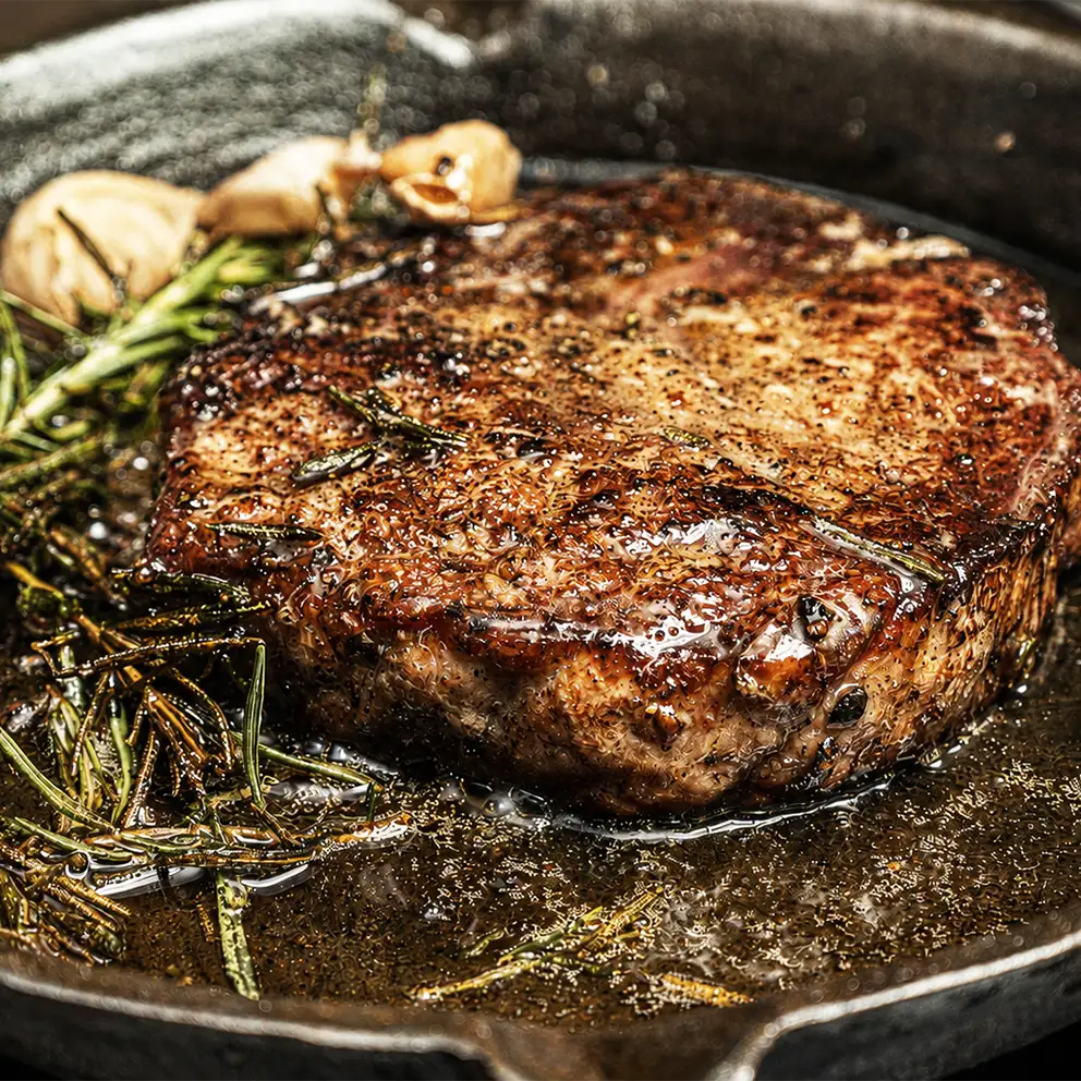 close up of new york style steak meal
