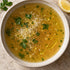 close up shot of chicken bone broth in ceramic bowl